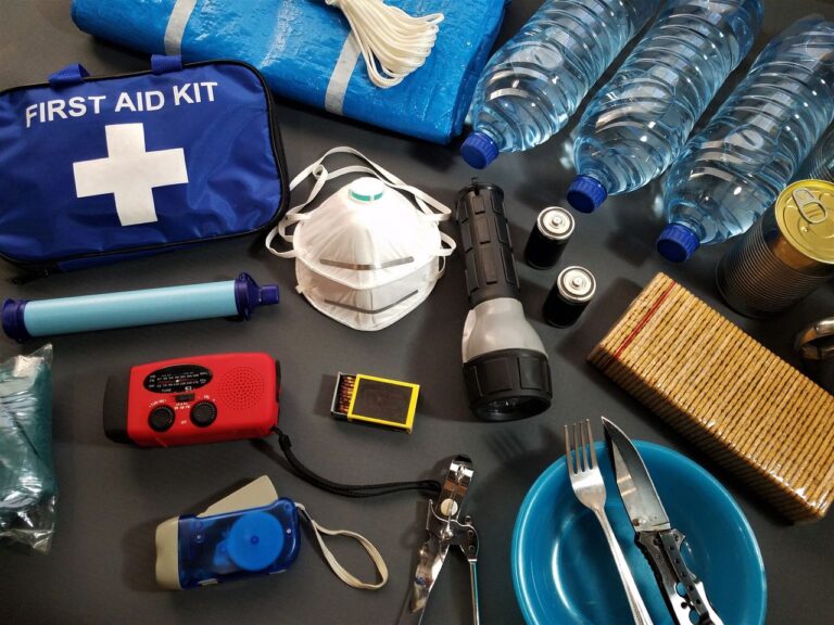 Items from a hurricane preparedness kit laid out on a table.